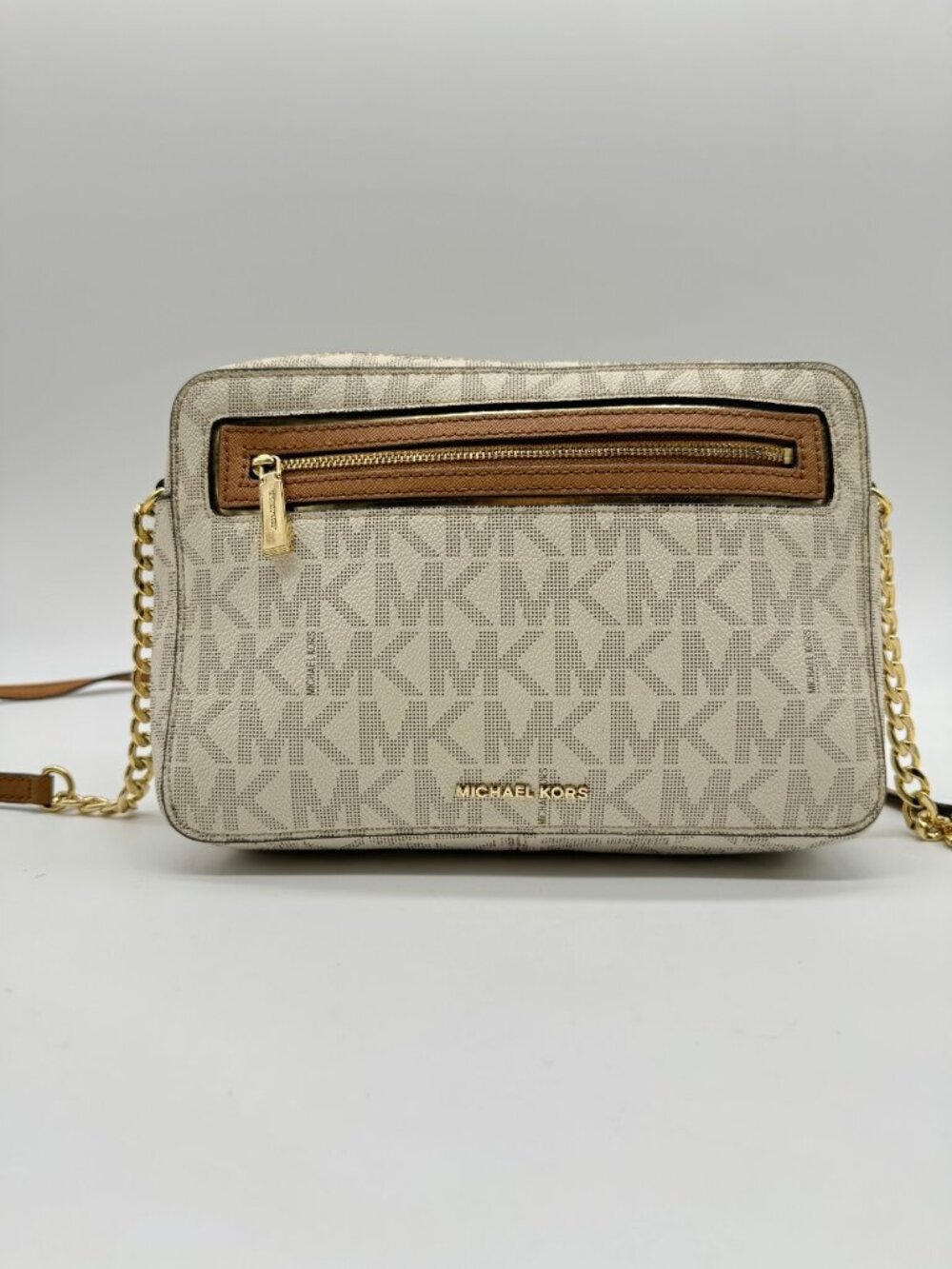 MICHAEL KORS Jet Set East West logo coated canvas large crossbody bag in Vanilla